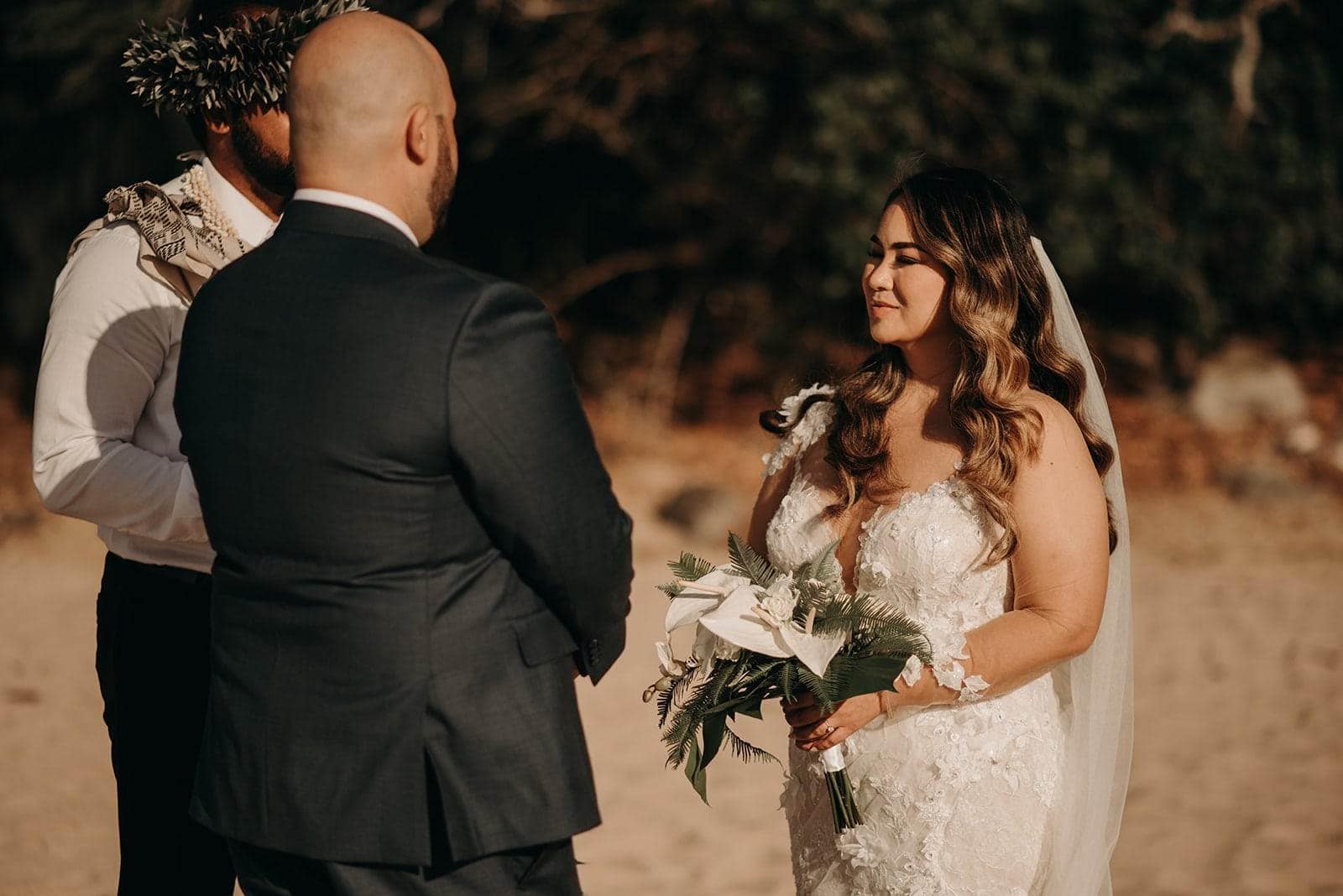 beautiful bride and groom photos with white floral arrangements