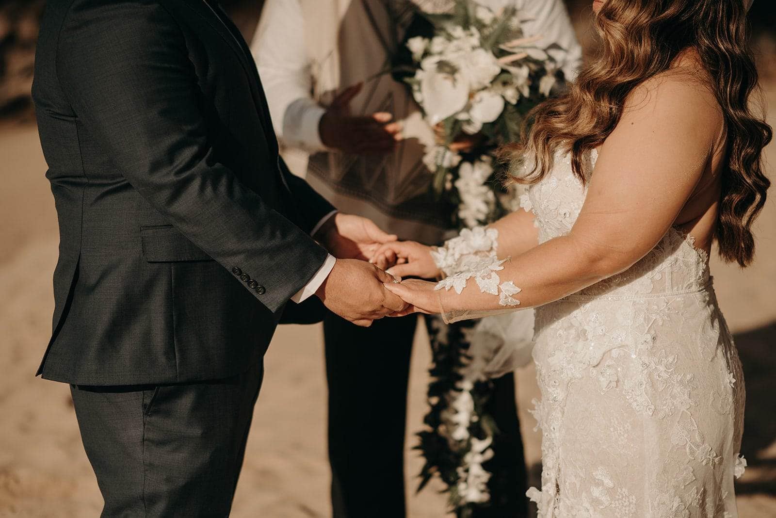 beautiful bride and groom photos with white floral arrangements