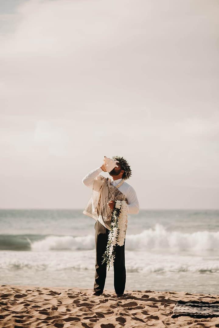 beautiful bride and groom photos with white floral arrangements